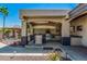The backyard provides an outdoor kitchen, grill and seating area at 5511 N 128Th Dr, Litchfield Park, AZ 85340