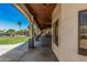 Covered patio offers outdoor living with a pool view and ceiling fans to keep you cool at 5511 N 128Th Dr, Litchfield Park, AZ 85340
