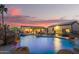 Inviting outdoor space with a large pool, rock features, and ample seating at 5511 N 128Th Dr, Litchfield Park, AZ 85340