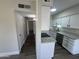 Well-lit kitchen showcasing granite countertops, stainless steel appliances, and white cabinetry at 555 N May -- # 29, Mesa, AZ 85201