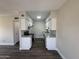 Bright kitchen with granite counters, stainless steel appliances, white cabinets, and wood-look floors at 555 N May -- # 29, Mesa, AZ 85201