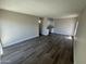 Open-concept living room features wood floors and neutral paint for a serene and inviting atmosphere at 555 N May -- # 29, Mesa, AZ 85201