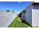 Side yard with grass, block wall, and exterior building features at 5634 N 39Th Ave, Phoenix, AZ 85019