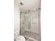 Modern bathroom featuring a glass-enclosed shower with gray tile and a built-in niche at 5634 N 39Th Ave, Phoenix, AZ 85019