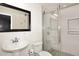 Modern bathroom featuring white tile, modern shower, and pedestal sink at 5634 N 39Th Ave, Phoenix, AZ 85019