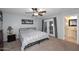 Bedroom with carpet flooring and doors that lead to the backyard and a bathroom at 5634 N 39Th Ave, Phoenix, AZ 85019