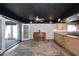 Open bonus room with piano, bar area, and access to an outdoor space at 5634 N 39Th Ave, Phoenix, AZ 85019