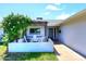 Inviting front entrance with a charming outdoor seating area and a stylish blue front door at 5634 N 39Th Ave, Phoenix, AZ 85019