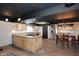 Modern kitchen with stainless steel appliances, an island, and a dining area for Gathering meals at 5634 N 39Th Ave, Phoenix, AZ 85019