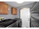 Well-organized laundry room with modern washer and dryer and ample storage at 5634 N 39Th Ave, Phoenix, AZ 85019