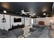 Cozy living room with a large sectional sofa, entertainment center, and ambient lighting at 5634 N 39Th Ave, Phoenix, AZ 85019