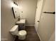 Neat bathroom featuring contemporary sink and vanity, as well as a modern toilet at 5723 N 44Th Ln, Glendale, AZ 85301
