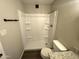 Clean bathroom with a tub/shower combo and modern vanity, perfect for relaxation and convenience at 5723 N 44Th Ln, Glendale, AZ 85301
