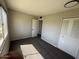 Bright, airy bedroom with large window, neutral walls, and comfortable carpeting, creating a relaxing atmosphere at 5723 N 44Th Ln, Glendale, AZ 85301