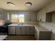 Well-lit kitchen showcasing stainless steel appliances, granite countertops, and ample cabinet space at 5723 N 44Th Ln, Glendale, AZ 85301