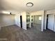 Spacious main bedroom with closet and mirrored vanity, plus ample lighting and plush carpeting at 5723 N 44Th Ln, Glendale, AZ 85301