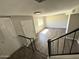 Upper level hallway and stairway showcases ample lighting, neutral colors, and wood flooring at 5723 N 44Th Ln, Glendale, AZ 85301