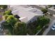 Aerial view of the property showcasing tile roof, landscaped backyard, covered patio with outdoor kitchen, and a serene setting at 621 W Desert Ave, Gilbert, AZ 85233