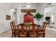 Elegant dining room featuring a wooden table, ornate chairs, and a decorative cabinet at 621 W Desert Ave, Gilbert, AZ 85233