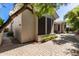 Exterior view of the house showcasing the desert landscaping, brick pavers, and an earth-toned color palette at 621 W Desert Ave, Gilbert, AZ 85233