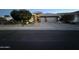 Beautiful home exterior featuring stone accents, tile roofing, manicured landscaping, and a two-car garage at 621 W Desert Ave, Gilbert, AZ 85233