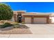 Charming single-story home featuring a neutral color scheme, landscaped front yard, and a two-car garage at 621 W Desert Ave, Gilbert, AZ 85233