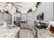 Stylish kitchen with gray cabinets, granite countertops, stainless steel appliances, and hardwood floors at 621 W Desert Ave, Gilbert, AZ 85233