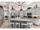 Spacious kitchen features gray cabinets, granite countertops, stainless steel appliances, and large center island with seating at 621 W Desert Ave, Gilbert, AZ 85233