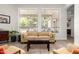 Cozy living room showcasing a plush sofa, large windows, and a neutral color palette at 621 W Desert Ave, Gilbert, AZ 85233