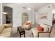 Bright living room with comfortable seating, light hardwood floors, and neutral wall paint at 621 W Desert Ave, Gilbert, AZ 85233