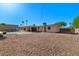Spacious backyard featuring desert landscaping, a covered patio, and a sparkling pool at 6602 E Heather Dr, Mesa, AZ 85215