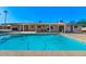 Refreshing pool surrounded by a covered patio, offering a perfect oasis for relaxation and entertainment at 6602 E Heather Dr, Mesa, AZ 85215