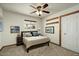 Comfortable bedroom with natural light, neutral colors, and wood trim throughout at 6602 E Heather Dr, Mesa, AZ 85215