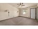 Empty bedroom with a ceiling fan, natural light, and views of the outdoor landscape at 6602 E Heather Dr, Mesa, AZ 85215