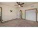 Bright bedroom featuring a ceiling fan, natural light, and spacious closet at 6602 E Heather Dr, Mesa, AZ 85215