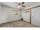 Minimalist bedroom featuring neutral colors, natural light, and hardwood trim at 6602 E Heather Dr, Mesa, AZ 85215