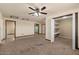 Spacious bedroom with hardwood trim, neutral carpeting, and closet with built-in shelving at 6602 E Heather Dr, Mesa, AZ 85215