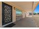 Welcoming front entry featuring a decorative door, stone accents, and covered porch, creating inviting curb appeal at 6602 E Heather Dr, Mesa, AZ 85215