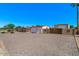 Spacious property with a large driveway, garage, and additional storage, offering ample parking and convenience at 6602 E Heather Dr, Mesa, AZ 85215