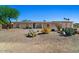 Charming single-story home featuring desert landscaping, cozy curb appeal, and ample natural light at 6602 E Heather Dr, Mesa, AZ 85215