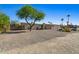 Charming single-story home featuring desert landscaping, cozy curb appeal, and ample natural light at 6602 E Heather Dr, Mesa, AZ 85215
