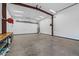 Large garage/workshop area with work benches, ample storage, and overhead lighting at 6602 E Heather Dr, Mesa, AZ 85215