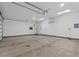 Large garage with high ceilings and plenty of space for storage and vehicles at 6602 E Heather Dr, Mesa, AZ 85215