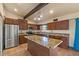 The kitchen features stainless steel appliances, granite countertops, an island, and an open concept design at 6602 E Heather Dr, Mesa, AZ 85215