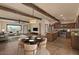 Open-concept living space featuring recessed lighting, hardwood floors, ceiling fan, and an adjacent kitchen at 6602 E Heather Dr, Mesa, AZ 85215