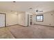 Large carpeted room with a separate entrance and backyard access at 6602 E Heather Dr, Mesa, AZ 85215
