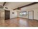 Spacious living room with tile floors, wood accents, and plenty of natural light at 6602 E Heather Dr, Mesa, AZ 85215
