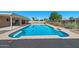 Sparkling pool with rock landscaping and lush landscaping, perfect for outdoor relaxation and enjoyment at 6602 E Heather Dr, Mesa, AZ 85215