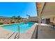 Inviting pool with lush landscaping and a charming covered patio area for outdoor enjoyment at 6602 E Heather Dr, Mesa, AZ 85215