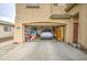 Spacious two-car garage featuring ample storage and a parked car at 703 N Redwood Ln, Buckeye, AZ 85326